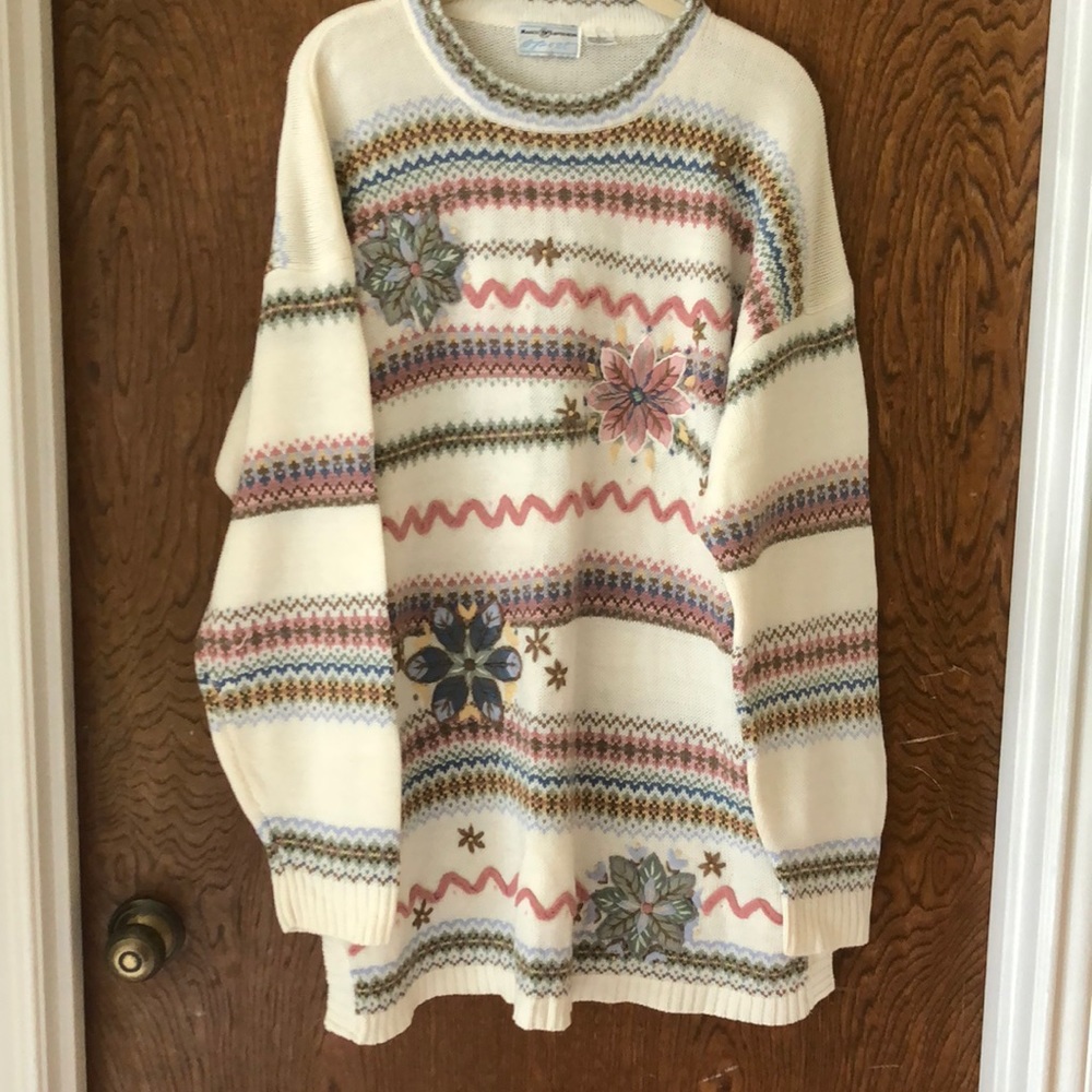 Sweater with embroidered flowers on front. 100% Acrylic